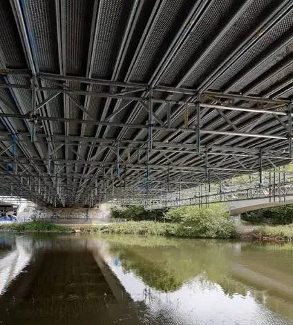 Steel girders beneath a bridge deck